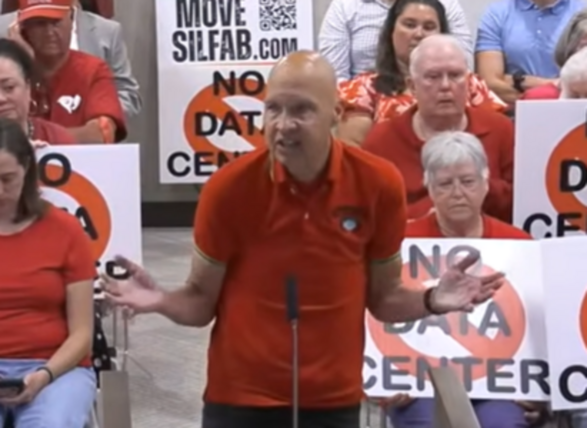 Octapharma Plasma executive Barry Pomeroy, backed by signs protesting other agenda items Monday, asks York County Council to work with Rock Hill to approve a tax incentive deal for the $1.5 billion Octapharma project in Rock Hill.
