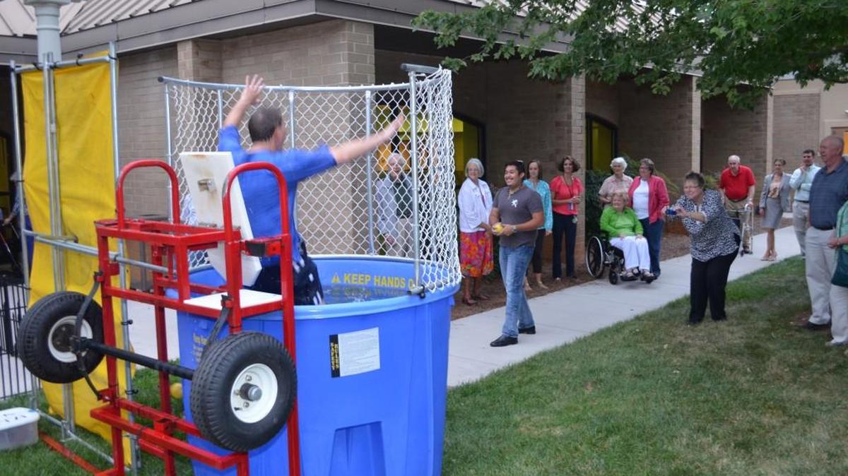 
Outgoing Westminster Towers CEO Tony Fountain is again headed into the water during a recent dunking booth session. 
