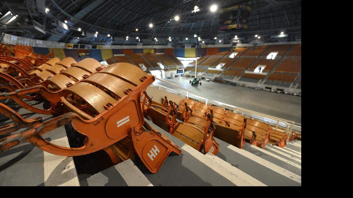 
Workers remove seats, lights and other items from the interior of Bojangles' Coliseum on Tuesday June 30, 2015. Workers started Monday on the $16 million renovation to make improvements to seating, technology, locker rooms, building infrastructure and more to prepare for the Charlotte Checkers return in the 2015-16 season.
