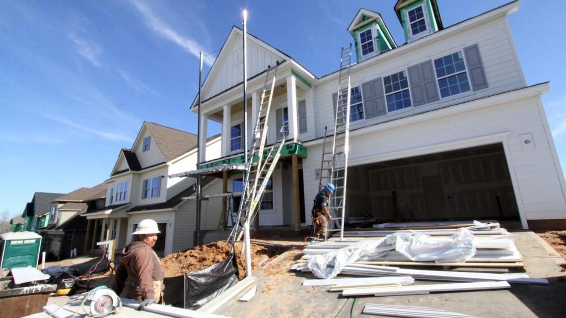 A new Fort Mill home under construction in a Herald file photo. York and Lancaster counties continue to grow, according to new U.S. Census Bureau estimates, but the pace is slowing.