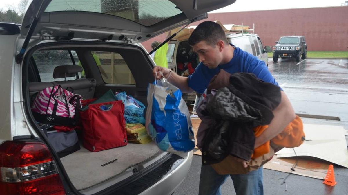 Johnathan Morton, a volunteer at the Rock Hill Goodwill store, removes donated items from a vehicle Wednesday.