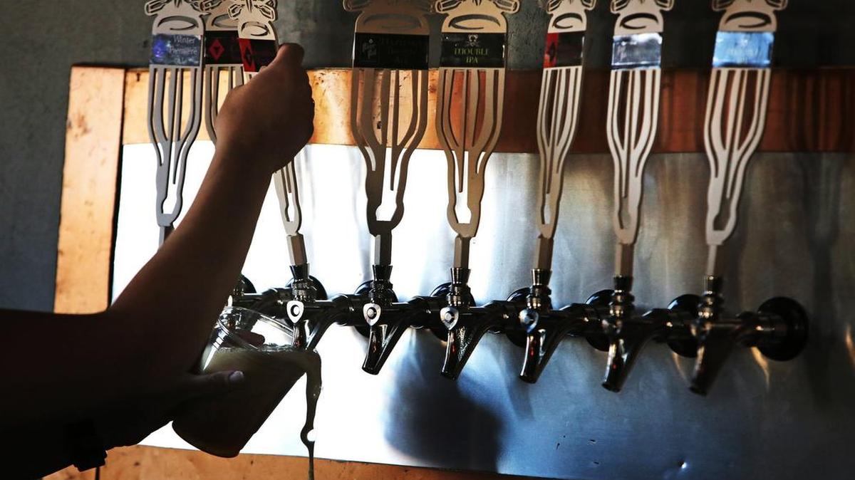 Some tourists enjoy sampling local craft beers, just like foodies sample local cuisine.