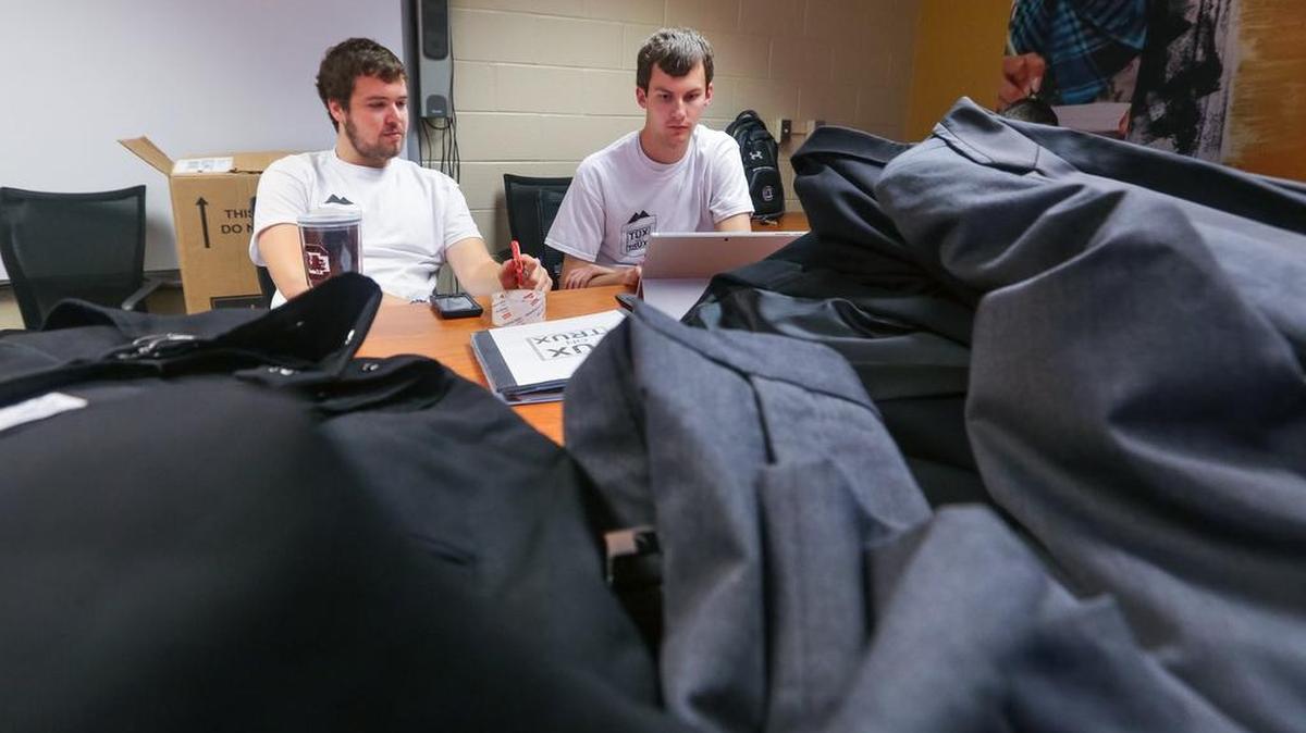 Clover High School graduate and USC business major Parker Moore, right, along with fellow students Jonathan Peterson and Jon Rice, left, created a business that promises to change tuxedo rental.