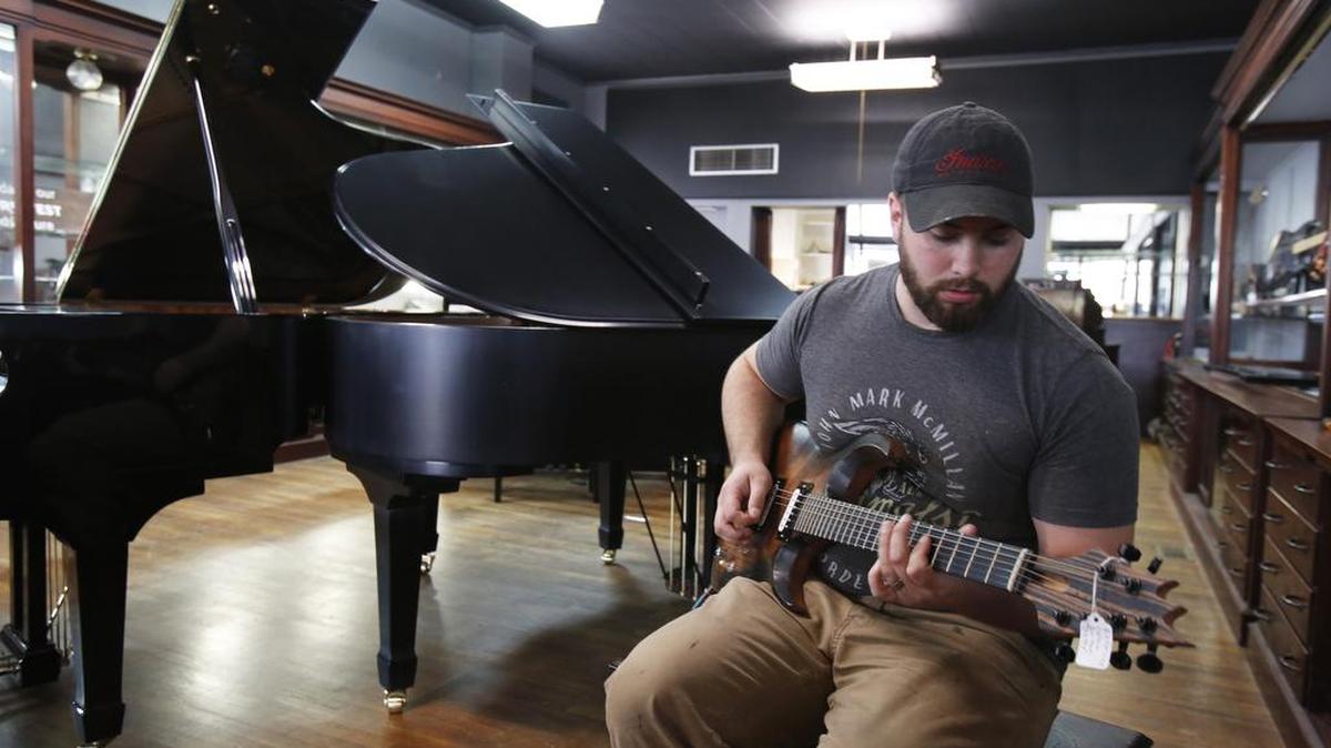 Jonathan Levister at his new music store and custom guitar-making operation in Chester, Experience Custom Shop.