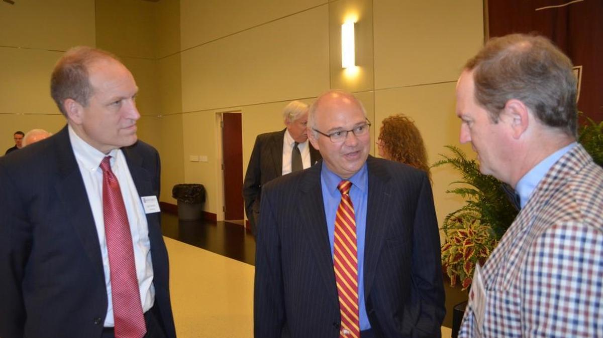 
Mark Vitner, center, managing director and senior economist for Wells Fargo, talks Friday about the economy with Winthop University President Dan Mahony, left, and state Sen. Greg Gregory of Lancaster. 
