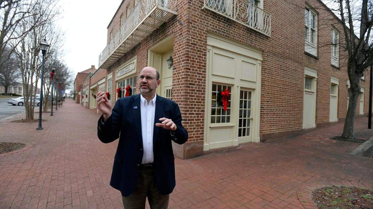 Kannapolis City Manager Mike Legg talks about some of the plans the city has to revitalize the downtown area, while on a walking tour of West Avenue on Monday, December 21, 2015. The city of Kannapolis has purchased property in downtown in an ambitious effort to revitalize an area that has been sagging for a long time.