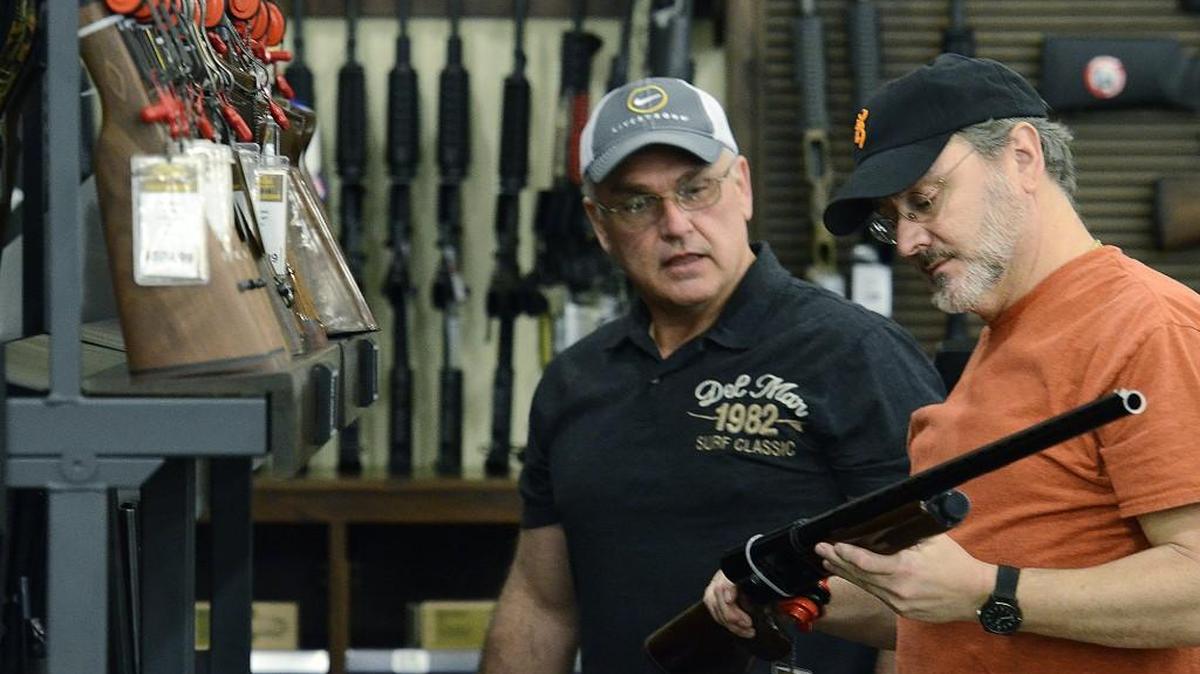 Glenn Davis (left), and Rick Hall, both from Lincolnton, NC were interested in both rifles and shot guns as they shopped at the new Cabela's store in Ft. Mill, SC. Outdoor enthusiasts who are Cabela's Club members were able to visit and shop at the 104,000 sq. ft. store next to Carowinds in Ft. Mill, SC on March 11, 2015.