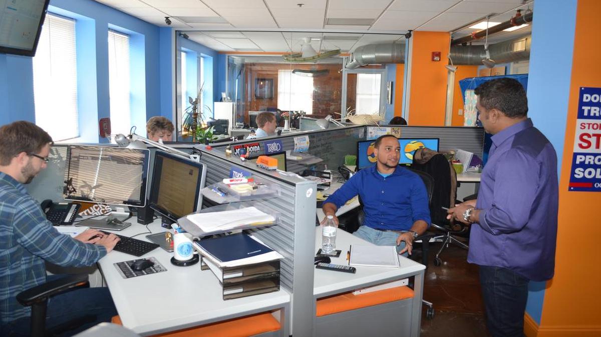 
Span Enterprises co-founder and CEO Agie Sundaram talks with several of his employees which support the company’s various programs on Tuesday. 
