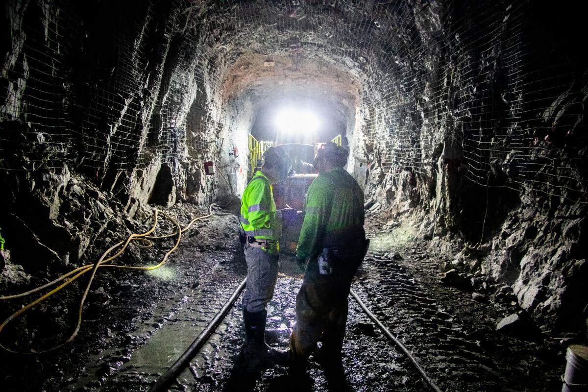 Two employees working in Haile Gold Mine’s Horseshoe Underground mine near one of the rarest pieces of underground equipment in the U.S. – a Rhino Raise borer. It’s one of only two in the country.