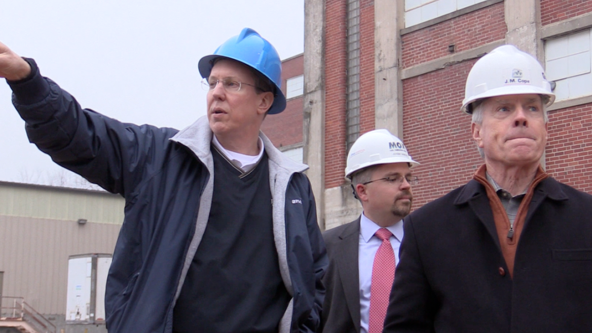 Rock Hill City Manager David Vehaun (left) and principal developer Skip Tuttle of The Tuttle Co. walk at the Lowenstein Building in Rock Hill at West White and Laurel streets in December 2017. The renovation of the Lowenstein Building was a key factor in the birth of the proposed University Center area, a 23-acre site with a 170,000-square-foot indoor sports arena, a hotel, student housing for nearby Winthrop University and more.