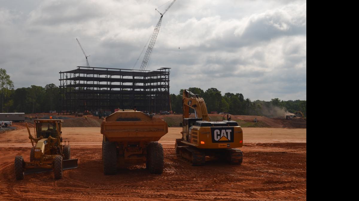 
The steel skeleton of the LPL Financial building in the Kingsley business park off S.C. 160 is flanked by construction equipment. LPL Financial was one of three companies that announced on June 16 last year it would come to the region, bringing millions of dollars in investment and thousands of jobs. 
