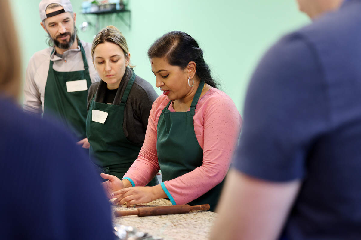 Santhoshi Radhakrishnan instructs her students at a class in February. Timothy Keating, left, and Chelsey Reynolds listen.