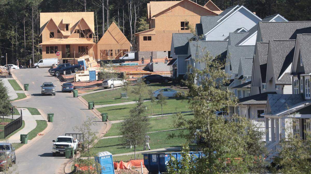 Finished homes and homes under construction in the same neighborhood are a common sight in Fort Mill, S.C.