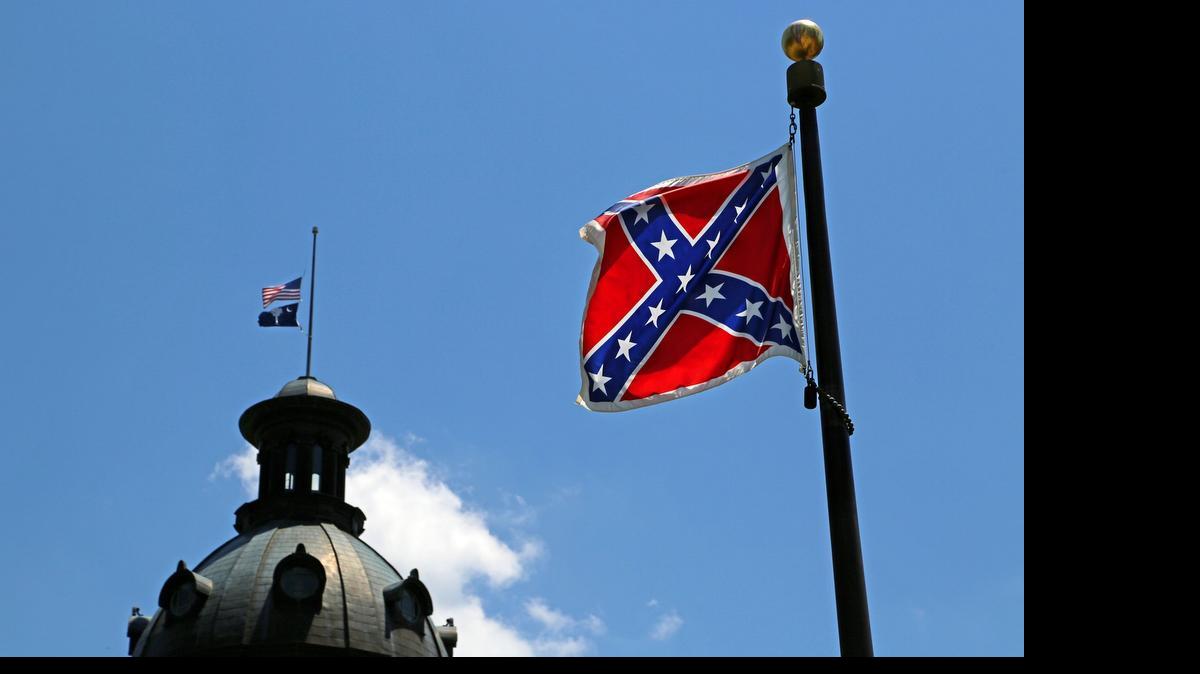 
The Confederate flag flies on the State House grounds on June 19.
