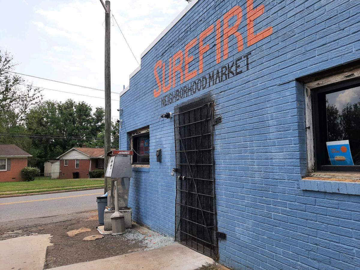 Glass was on the ground in front of a locked front door Monday as Surefire Neighborhood Market was closed. A fire on Sunday gutted much of the store in Rock Hill’s Sunset Park neighborhood.