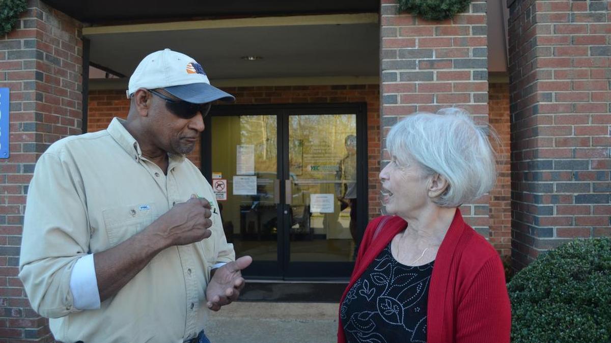 Vic Wilform, who has been with York Electric Cooperative for 43 years, explains how he will hook up services for Claudia Mady, the cooperative’s 50,000th customer.