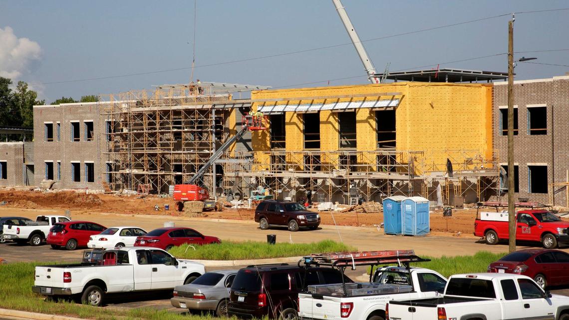An elementary and middle school complex, shown here in October is under construction on Gold Hill Road in Fort Mill. Flint Hill Elementary School will open next year. Flint Hill Middle School will follow in 2026. The elementary school is funded by impact fees, which could increase in the Fort Mill School District.