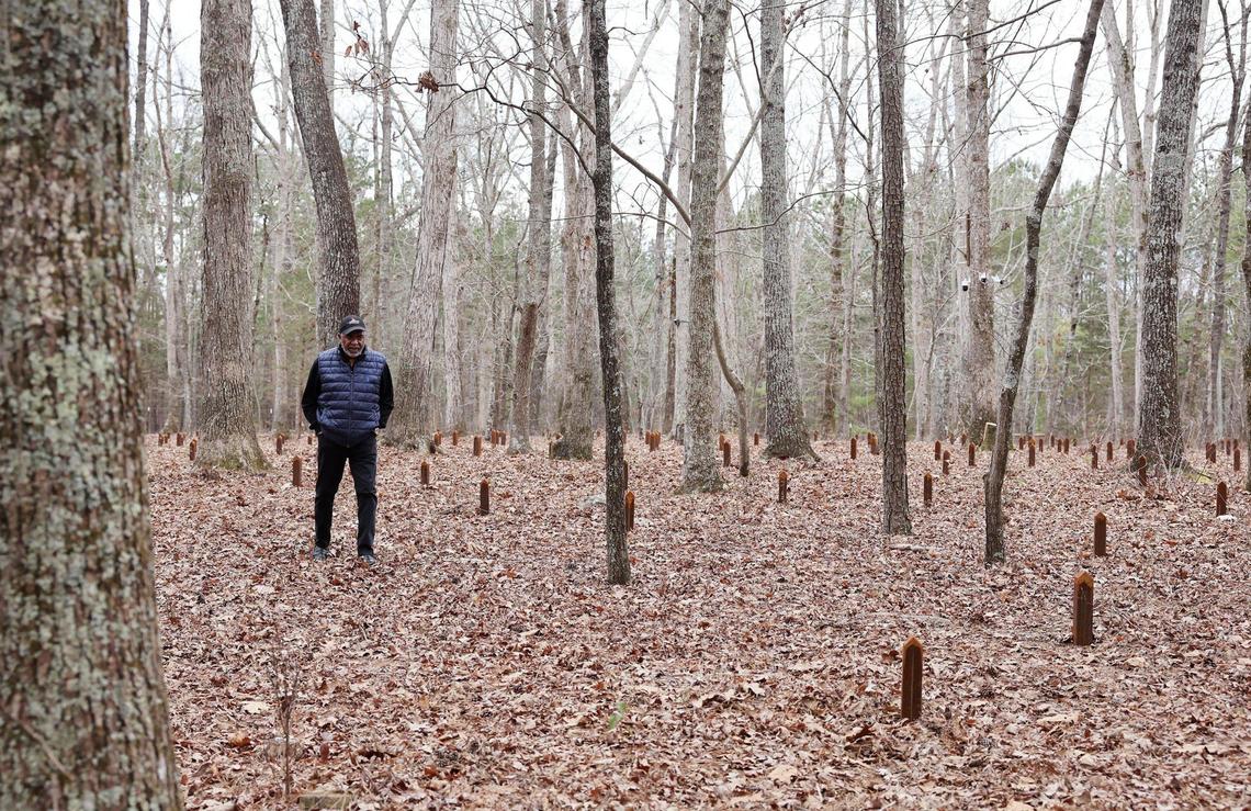 Anthony Johnson, pastor at Mount Zion Baptist Church, walks through a cemetery of enslaved people at Historic Brattonsville Saturday.