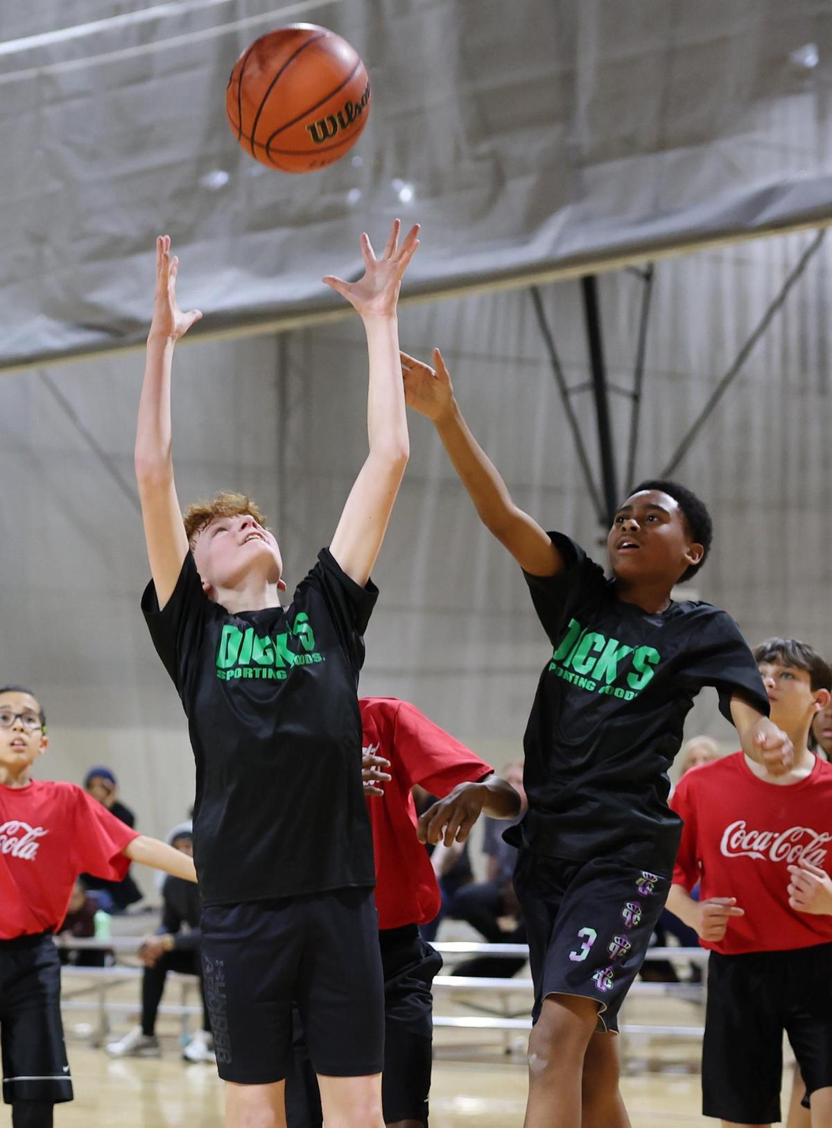 Children play basketball Wednesday at a City of Rock Hill Parks, Recreation and Tourism game at the Sports and Event Center.