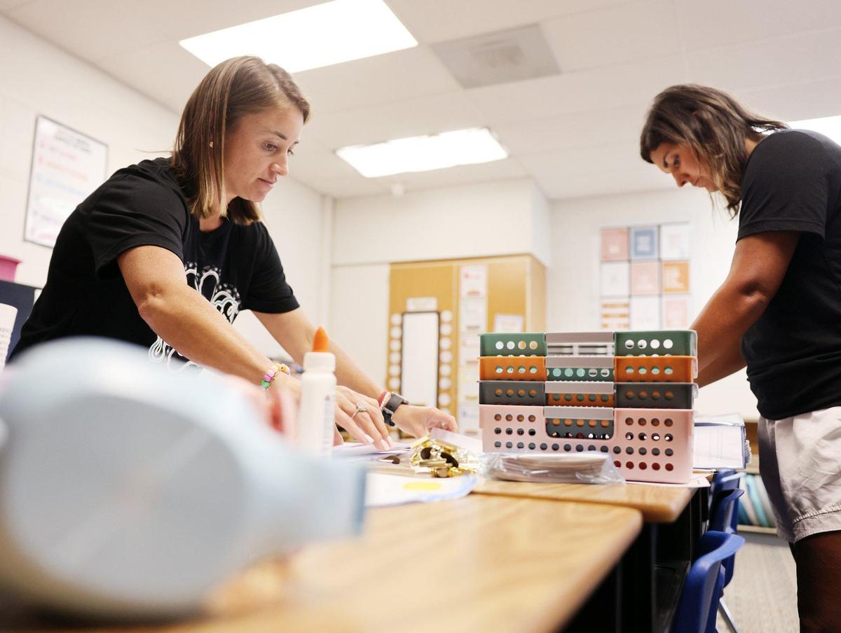 Aubrey Watson, left, and Haley Whitesides put together forms to give to students on the first day of school, which is Thursday in York. Clover and Chester County schools also start Thursday, which Rock Hill and Fort Mill start a week later. Lancaster County schools start Aug. 12.