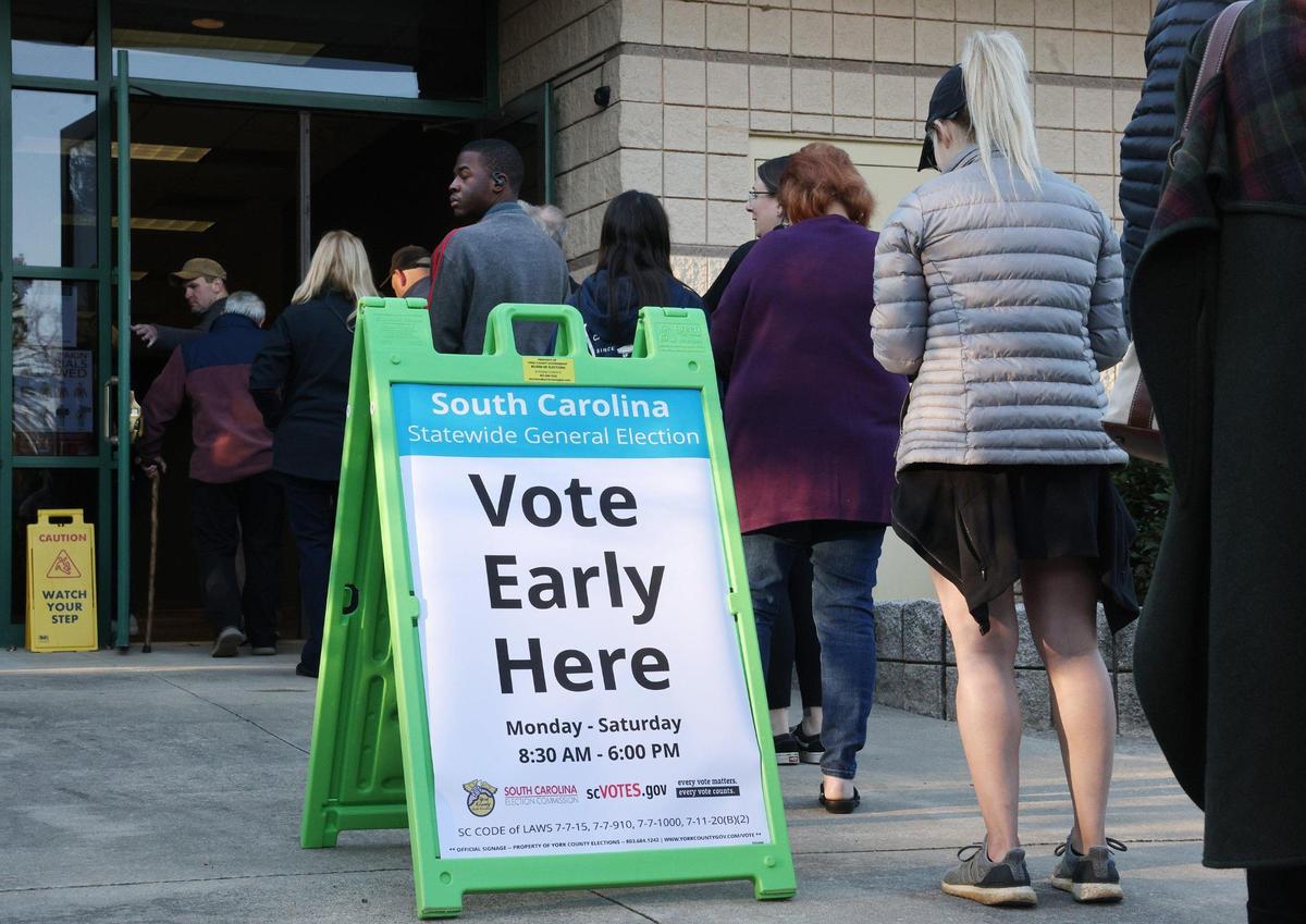 Voters wanting to cast their vote early line up at Baxter Hood Center in Rock Hill, S.C. Monday, Oct. 21, 2024.