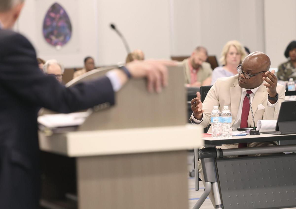 Rock Hill School Board member Montrio Belton talks about a $15.8 million shortfall Wednesday at the school board meeting.