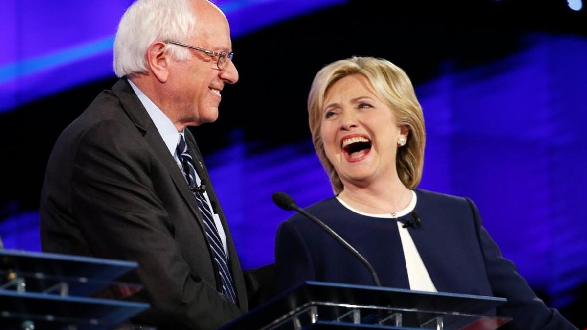 
Sen. Bernie Sanders, of Vermont, left, and Hillary Rodham Clinton laugh during the CNN Democratic presidential debate Tuesday in Las Vegas. 
