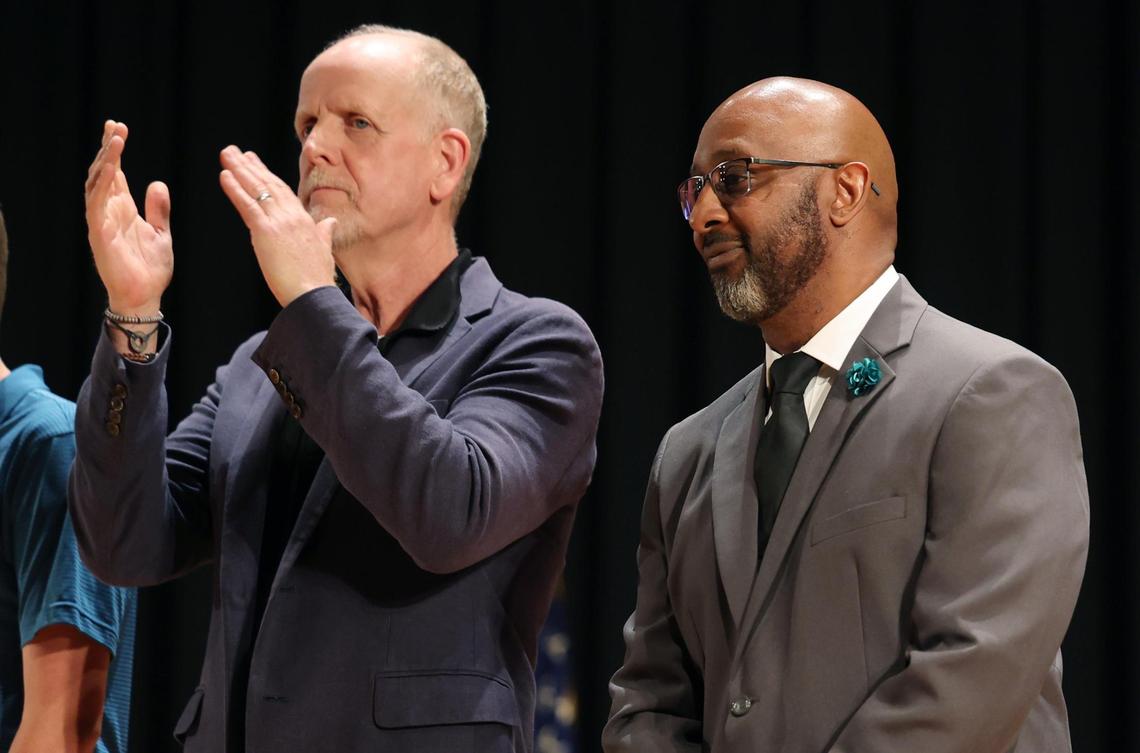 Dutchman Creek Middle School Principal Clayton Moton, right, attends the Rock Hill School Board meeting Tuesday.