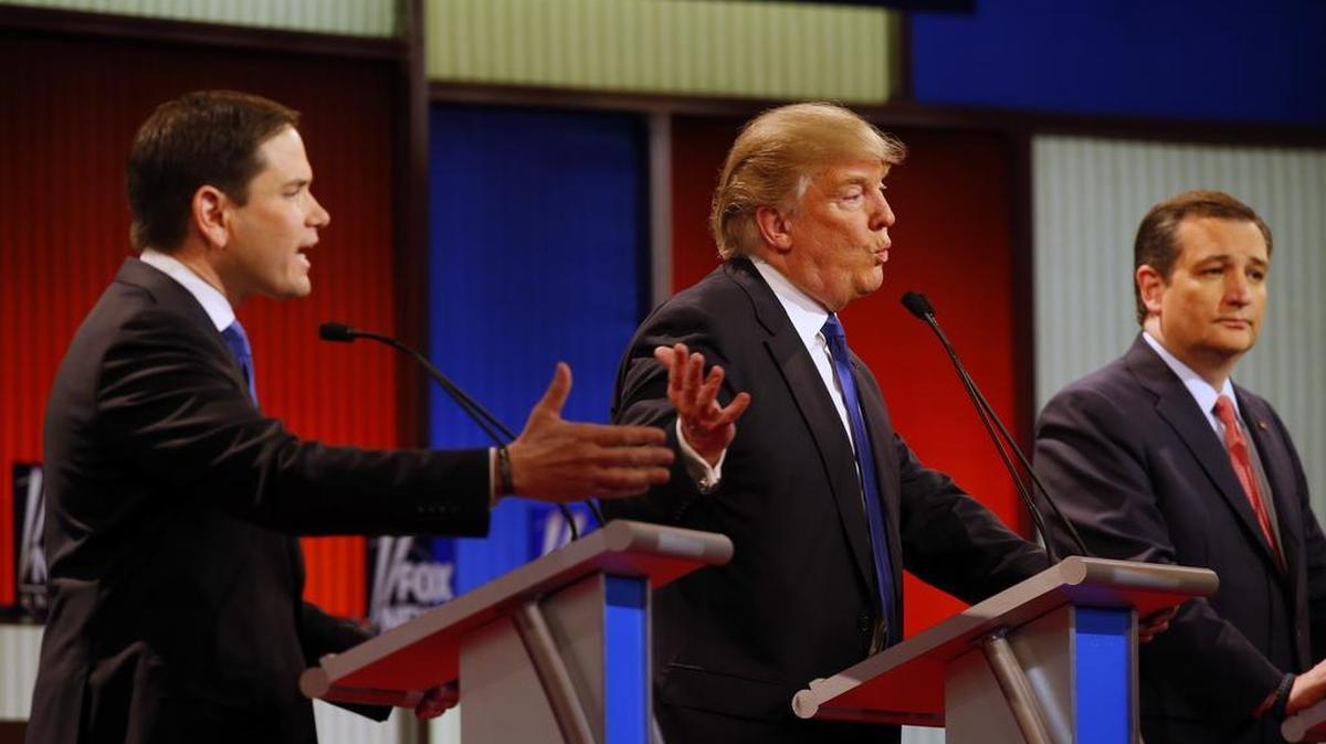 Republican presidential candidates Marco Rubio and Donald Trump argue a point as Ted Cruz listens during a debate Thursday in Detroit.