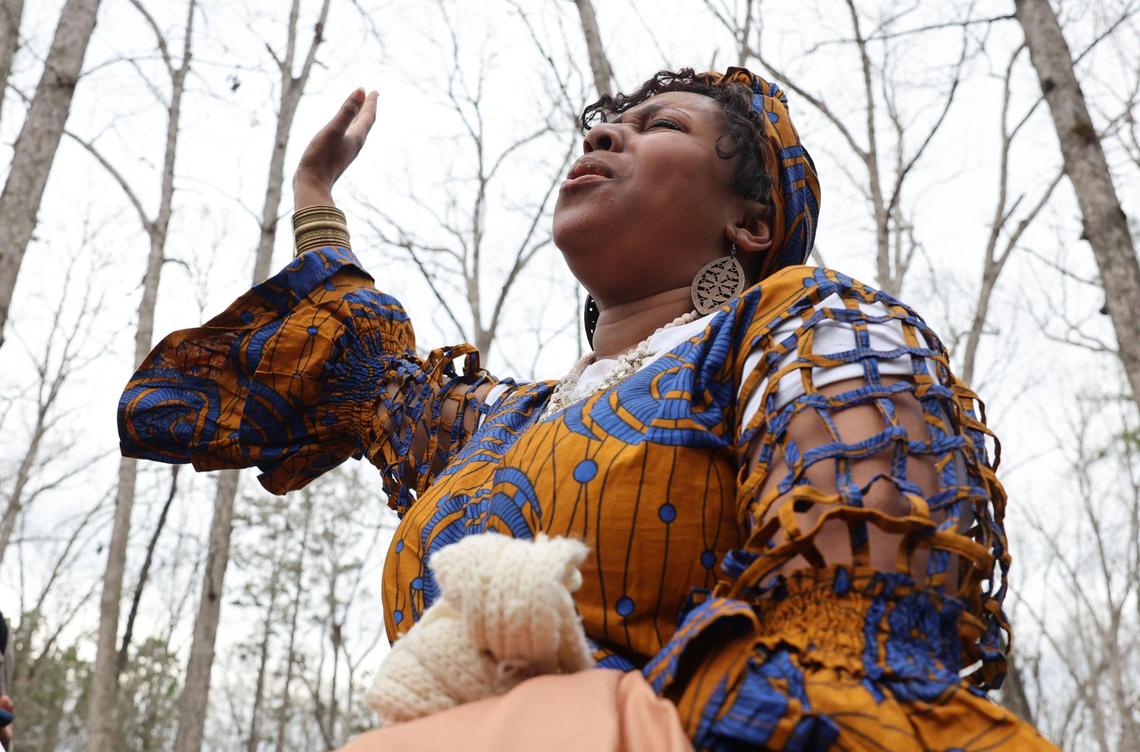 Vocalist Carlo L’Chelle Dawson sings during the reconsecration of burial sites of enslaved people at Historic Brattonsville Saturday.