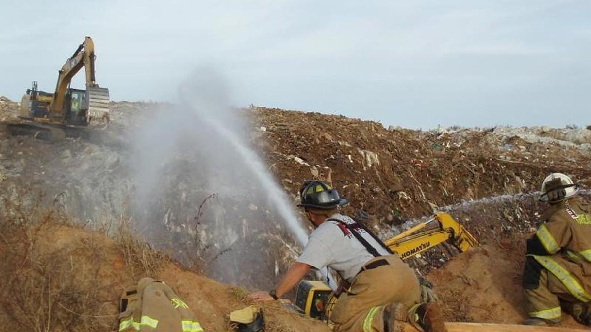 
Fire crews from five different counties battled the Bennett Landfill fire last November after flames burst through the surface
