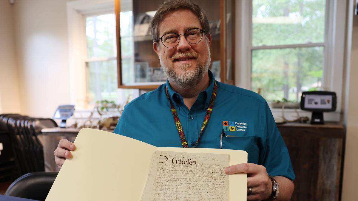 Ensley Guffey, archivist for the Catawba Indian Nation, holds a contract from 1796 that details plans to take two Catawba men to Ireland to perform in front of paying audiences, however, the men were abandoned in Edinburgh