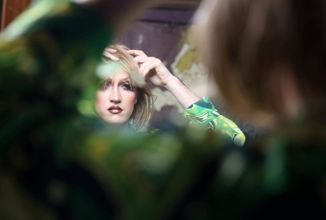 Will Lattman, known as Seveene Eleveene puts on a wig before performing at The Hideaway in Rock Hill, S.C.