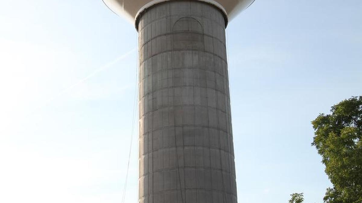 A work crew raised a water tank to the top of a new Rock Hill water tower on West Main Street on Friday.