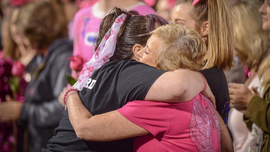 Libby Meadows, right, of Fort Mill gets a hug from Andrea Godbolt, the founder of the Pink Out.