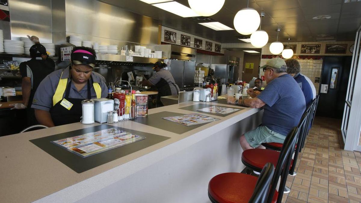 
 The new rebuilt Waffle House restaurant on North Cherry Road opened Tuesday morning at 7 am. The old iconic restaurant was razed and a brand new one built.
