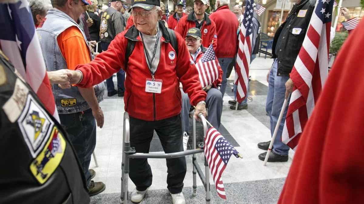 Frank Meliti joins fellow Honor Flight veterans as they are welcomed at Columbia Metropolitan Airport after returning from Washington.