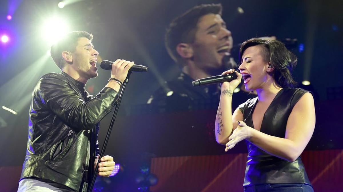 Nick Jonas and Demi Lovato announced that their Charlotte, Raleigh tour stops were canceled because of HB2 Monday.
