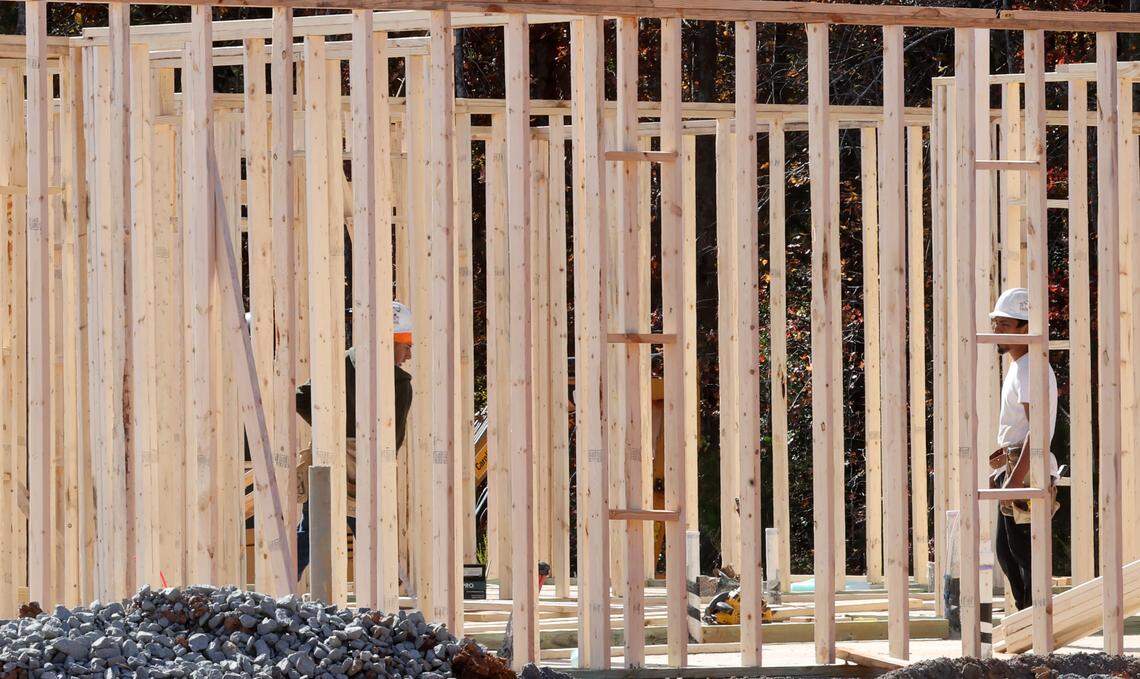 A construction crew works on a house in the Roselyn neighborhood in Lancaster County. Lennar is building there, and has submitted plans for another neighborhood across U.S. 521.
