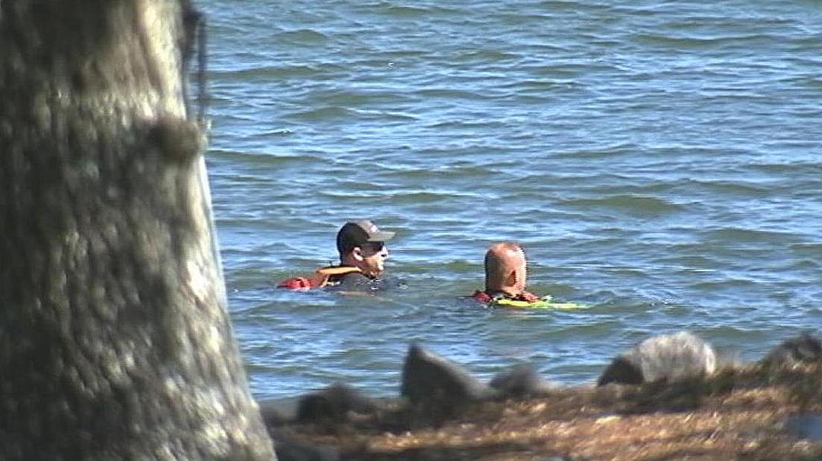 A dive team searches for a drowning victim Saturday on Lake Wylie.