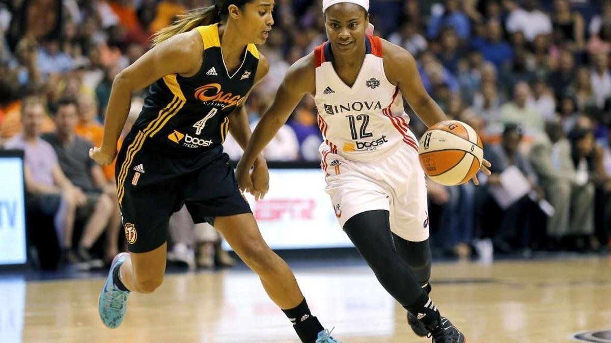 WNBA player and author Ivory Latta of York in a 2014 action shot in the WNBA. Latta will be grand marshal of the York MLK Parade Saturday.