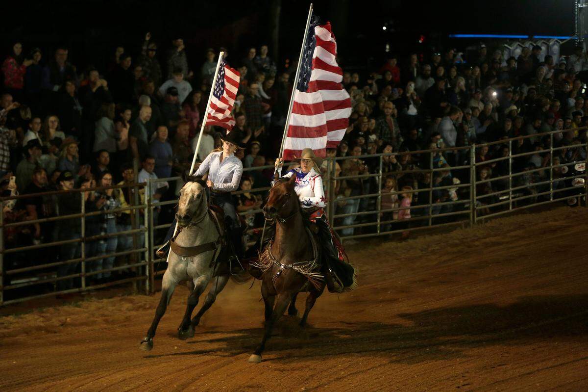 Rodeo entertainers ride with American flags Saturday, Oct. 15, 2022 at the Blackhawk Ranch rodeo.
