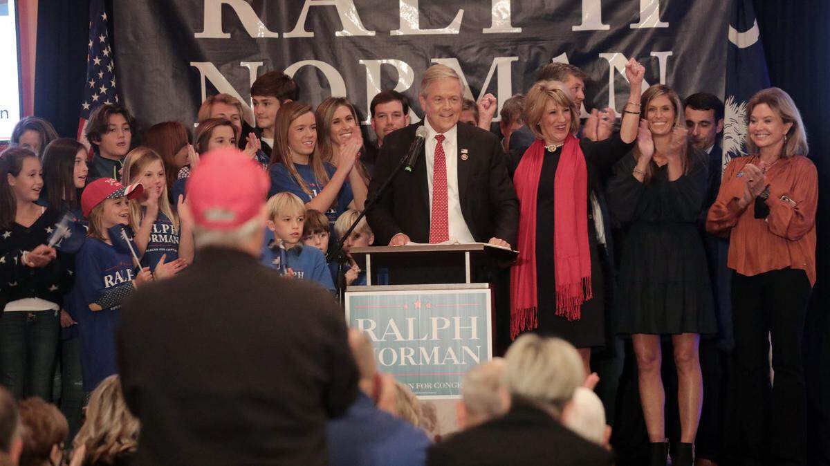 US Congressman Ralph Norman, center, and his family celebrate after Norman’s reelection Tuesday in Rock Hill.
