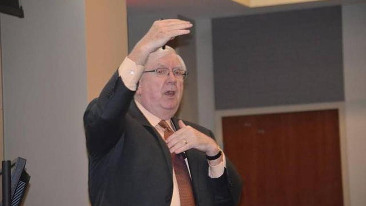 Larry Carroll of Carroll Financial of Charlotte demonstrates the volatility of the stock market during a recent annual seminar at Winthrop University.