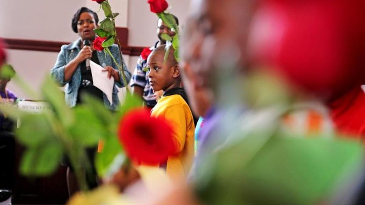 Children give roses to Mother Emanuel survivors, relatives