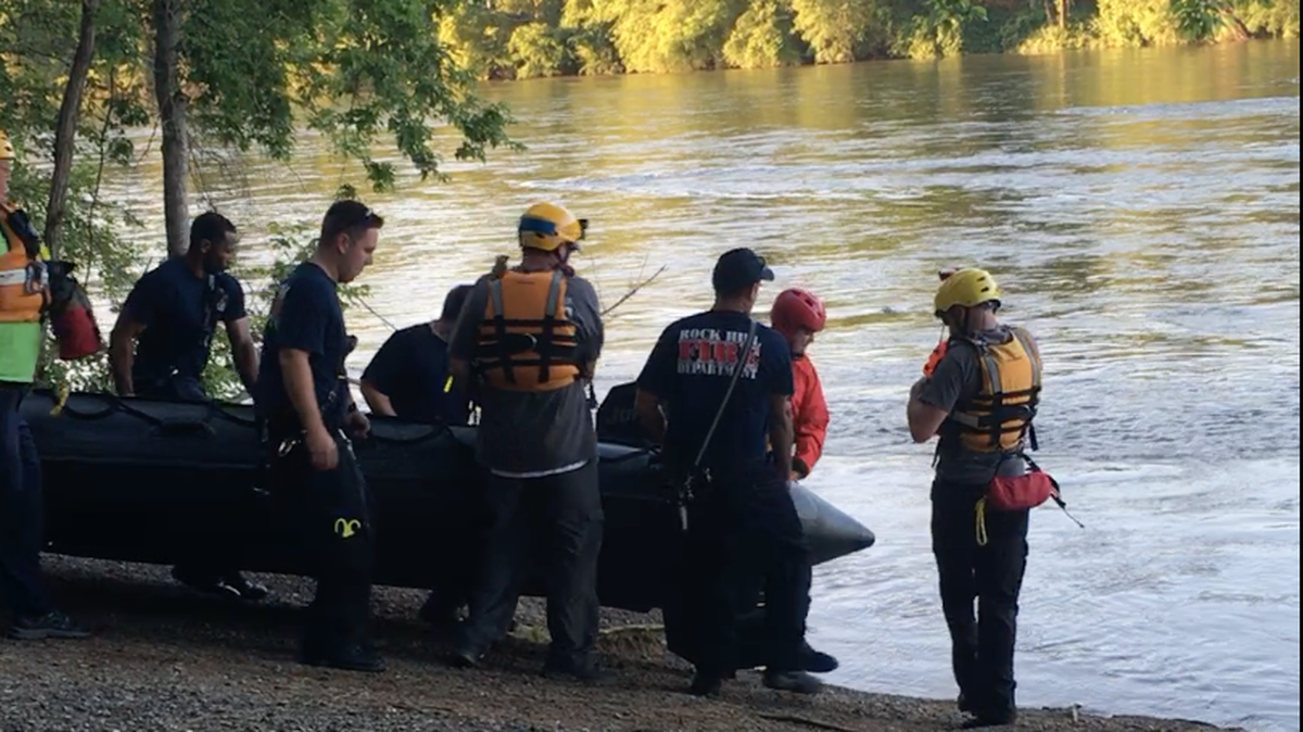 Crews from the Rock Hill Fire Department and York County Emergency Response Team prepare to launch a raft in the Catawba River on Tuesday to rescue three kayakers who were stranded in the water. The kayakers were rescued without injury.