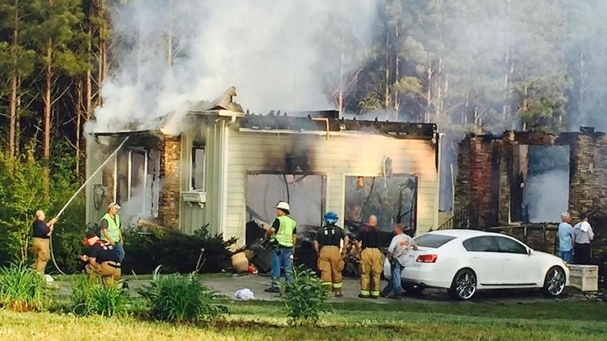 Firefighters from four departments responded to a blaze east of Rock Hill that is believed to be have been caused by lightning during afternoon storms Monday.
