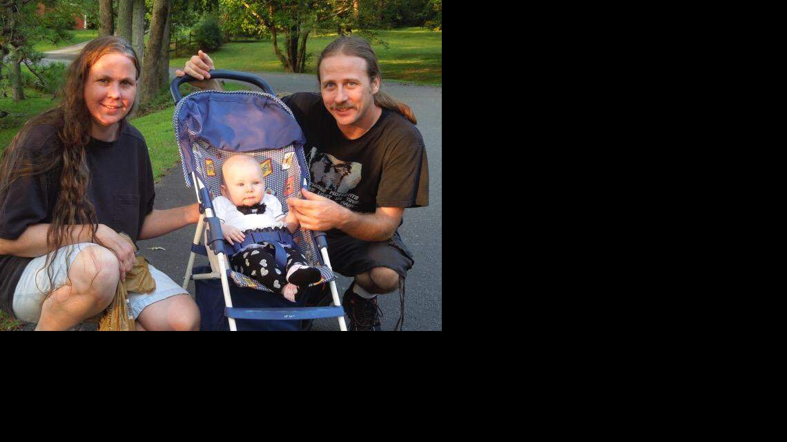 
David Wayne Plunkett with his wife Chelsea and daughter Catherine
