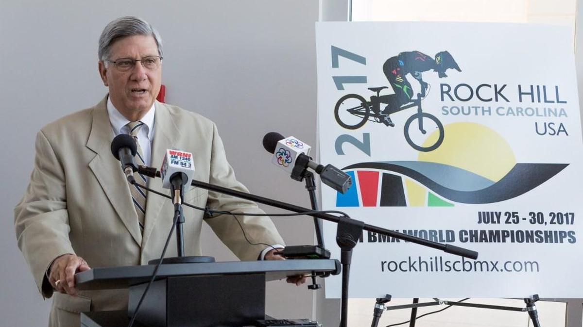 Rock Hill Mayor Doug Echols speaks during the Rock Hill Sports Commission’s ceremonial raising of the UCI flag at the city’s BMX Supercross Track on Monday.