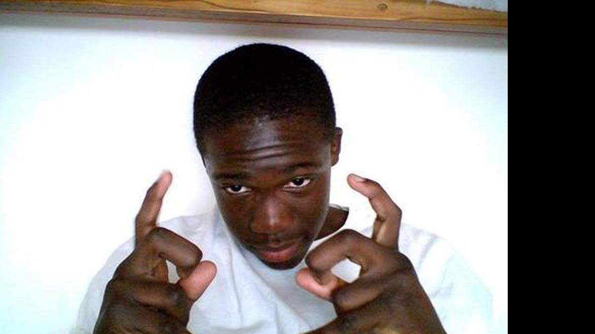 
This Facebook photo dated October 2009 shows Kwamne Clyburn making apparent gang signs. He would have been about 14 at the time. A gang expert said the signs appear to be made up.
